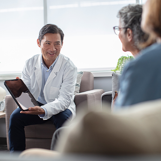 Professional speaking to patient and family