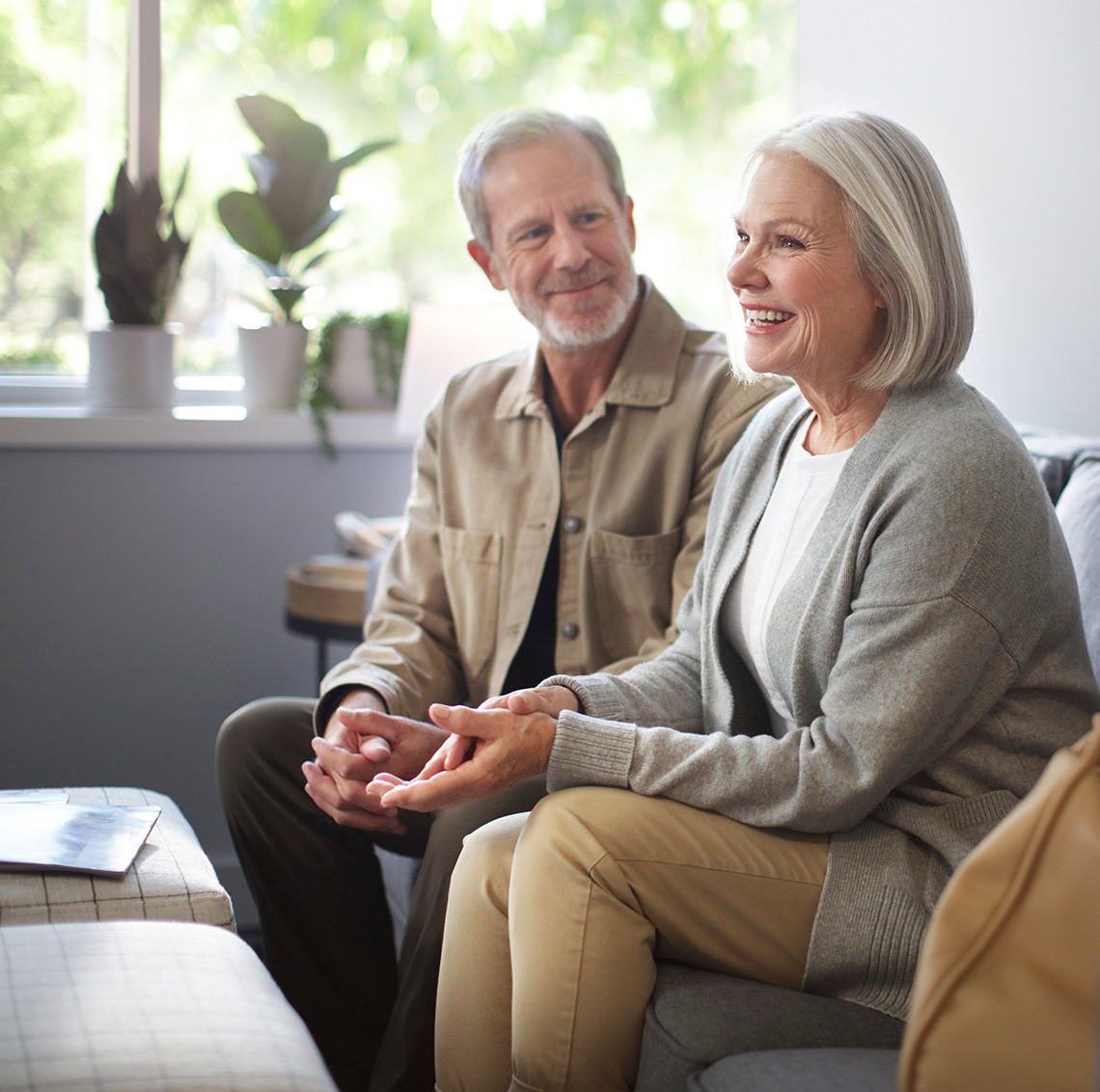 Man and woman sitting on couch
