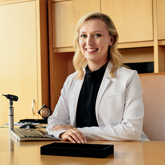 Women working together writing on a whiteboard