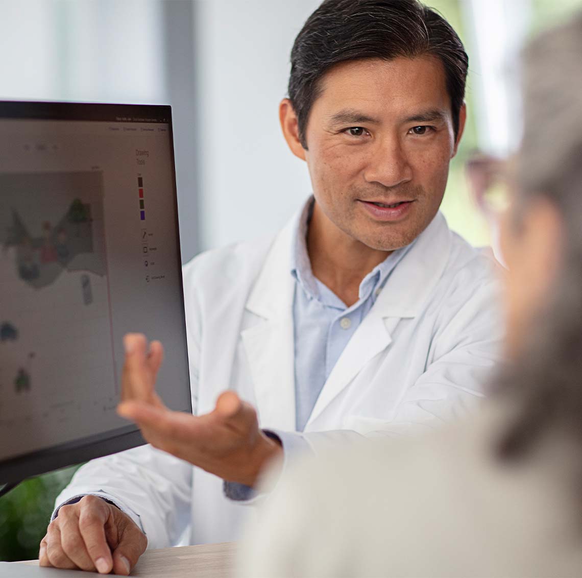 Hearing Professional talking to female patient