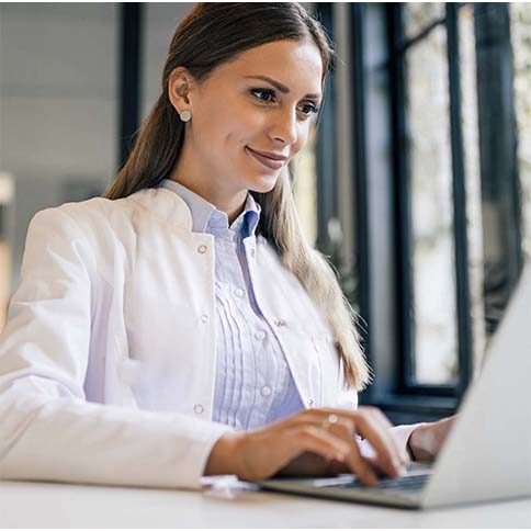 Professional using a laptop.