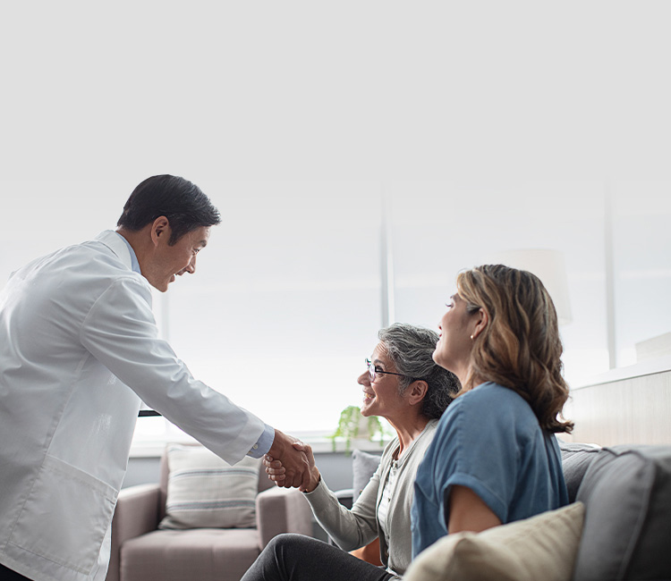 Hearing professional greeting two women